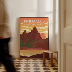 Framed Pinnacles National Park travel poster with sunset colors on floor by checkered tiles