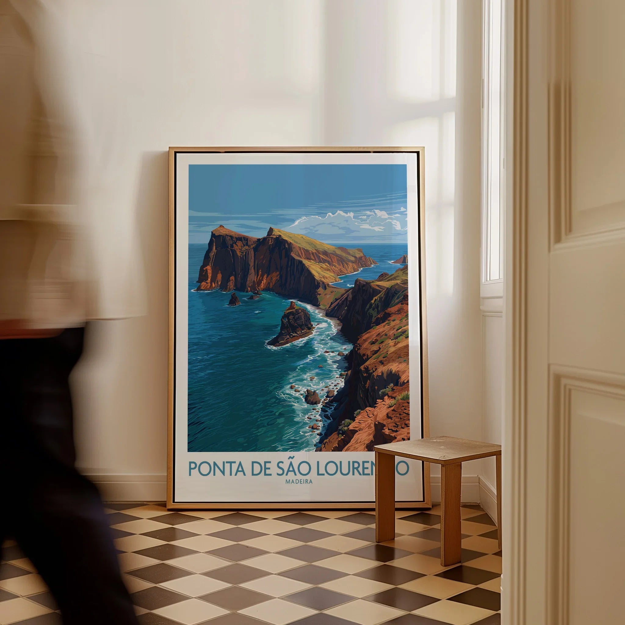 Framed Ponta de São Lourenço Madeira travel poster on floor, man walking past, home decor