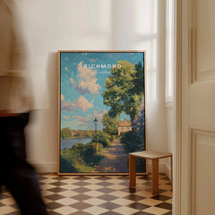 Richmond London travel poster art in frame on floor, bright hallway, man walking past
