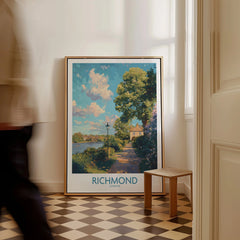 Richmond London travel poster framed on floor in bright hallway with man walking past