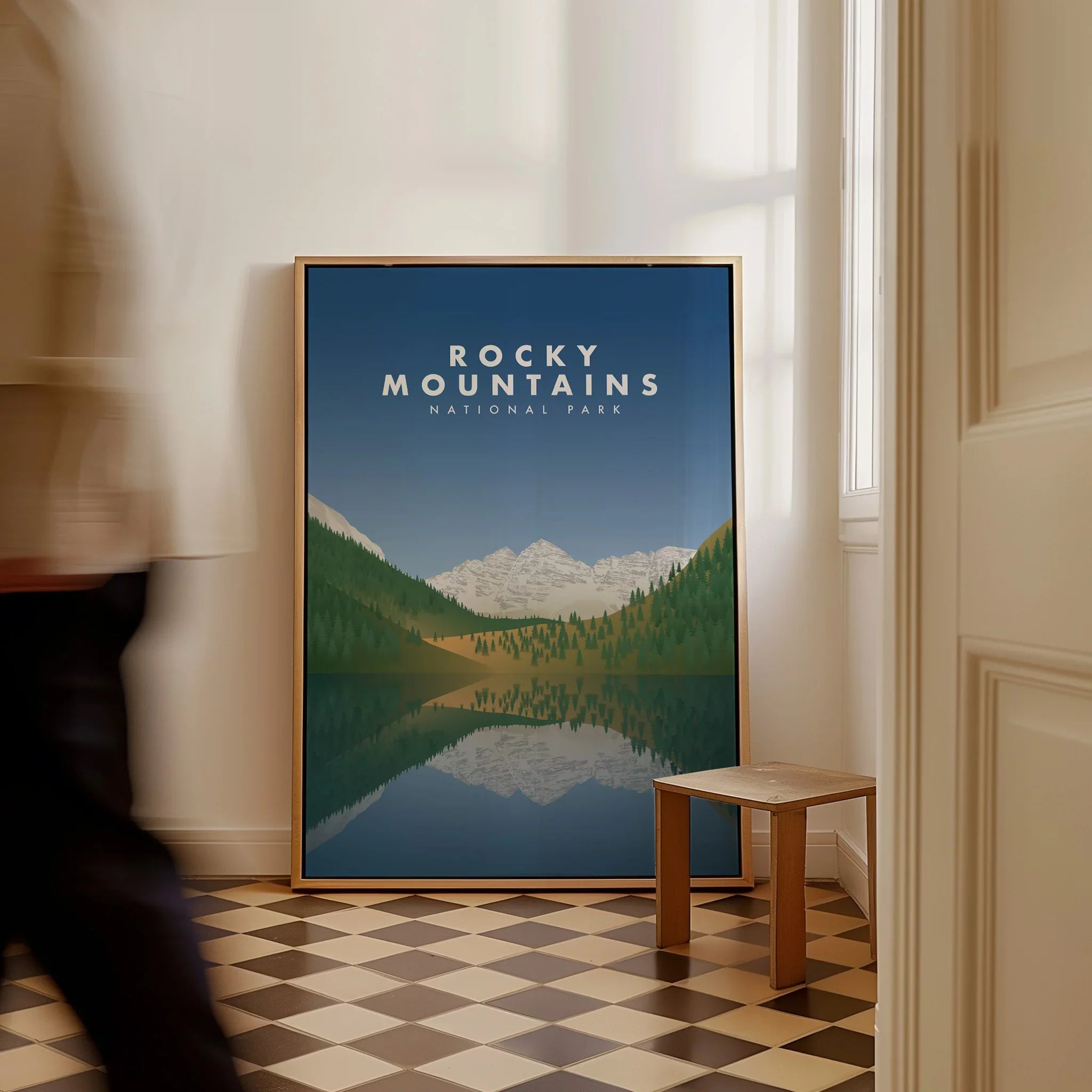 Framed Rocky Mountains National Park travel poster with lake reflection on checkered floor