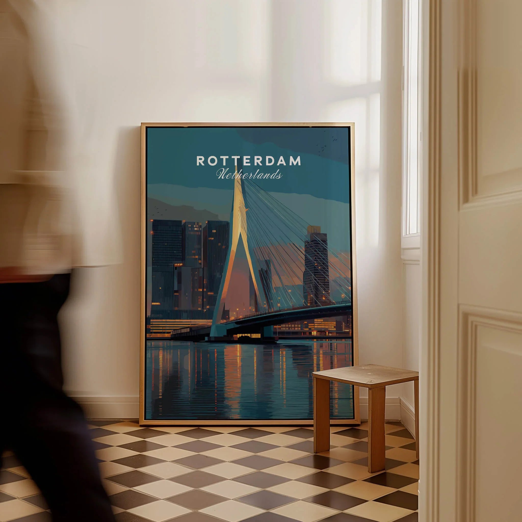 Framed Rotterdam Netherlands cityscape travel poster on floor in stylish home interior