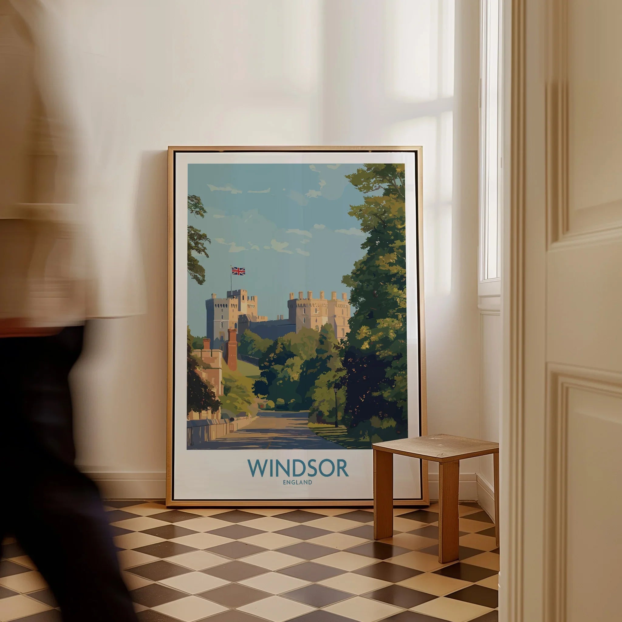 Framed Windsor England travel poster on checkered floor, man walking past, wall art decor
