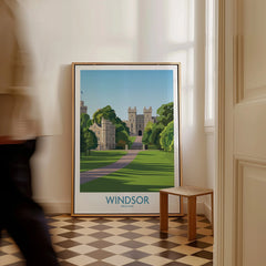Framed Windsor England travel poster with castle and greenery on floor in modern home.
