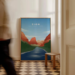 Framed Zion National Park travel poster on floor in bright room with checkered tile