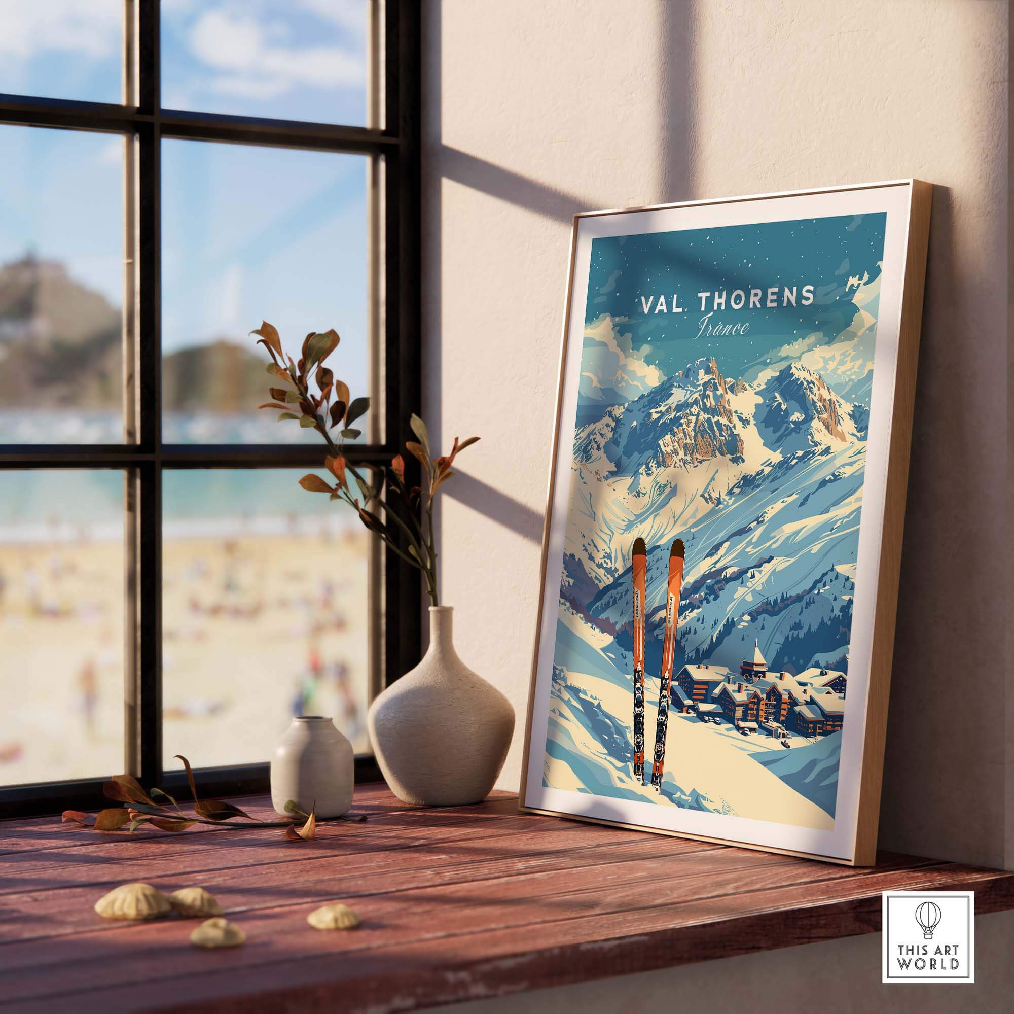 Val Thorens travel poster framed on a window sill, showcasing stunning mountain views and ski gear in a cozy setting.