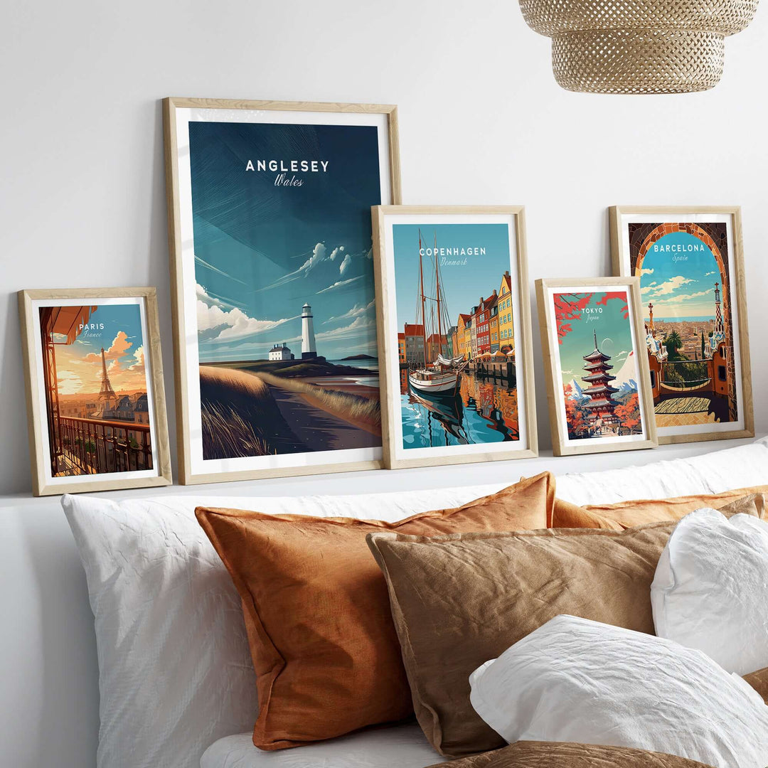 Framed coastal prints featuring Anglesey lighthouse and various world landmarks on a stylish home decor display.