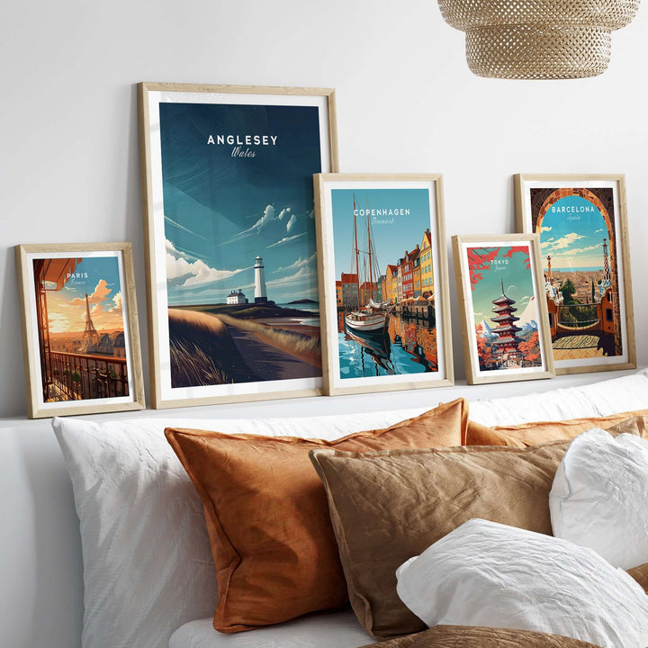 Framed coastal prints featuring Anglesey lighthouse and various world landmarks on a stylish home decor display.