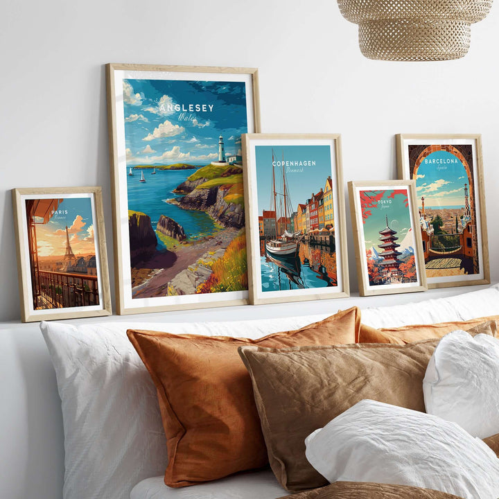 Anglesey Wales sailboats and lighthouse print displayed in a cozy home setting with other travel art prints.