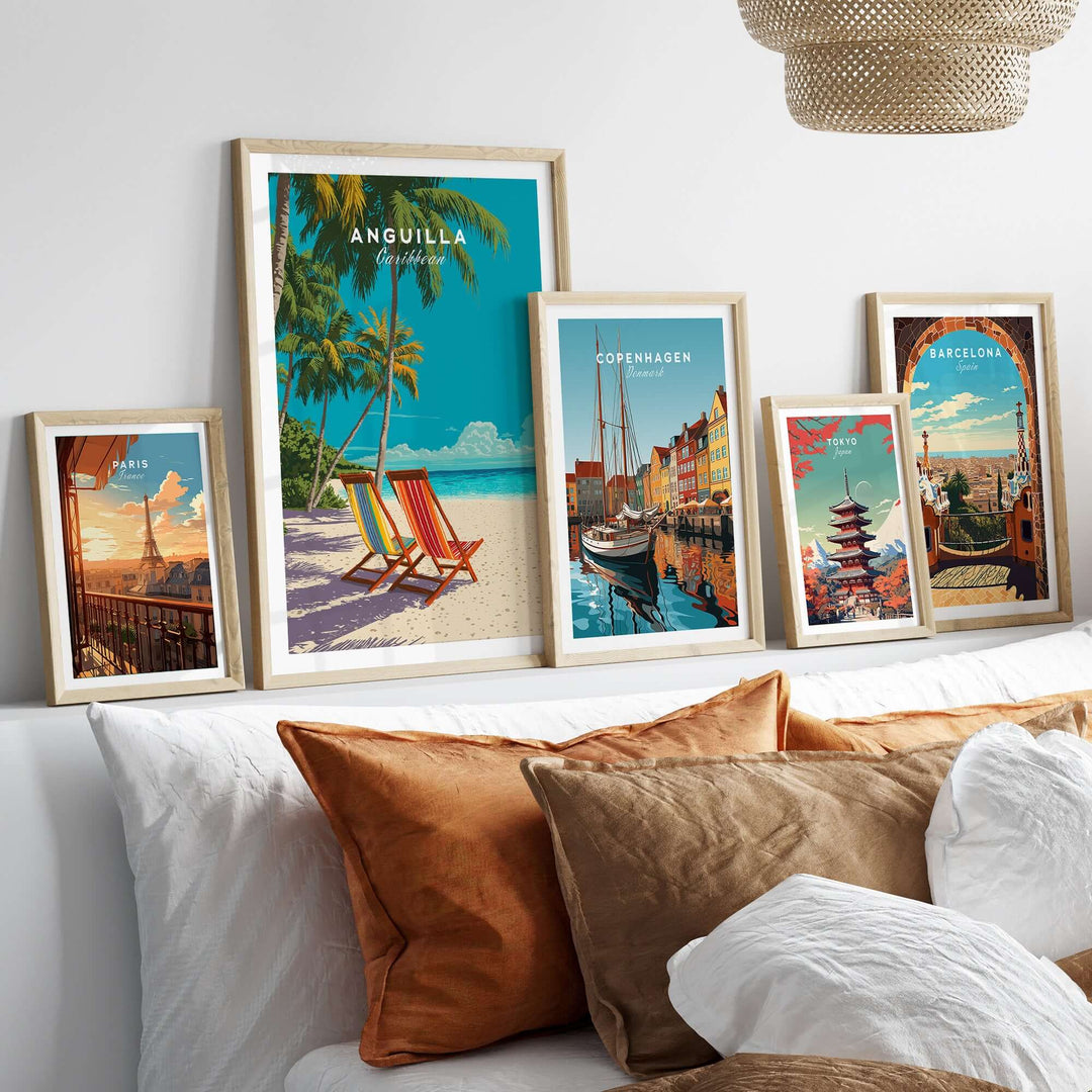 Anguilla Caribbean wall art print displayed with other travel posters on a stylish sofa, creating a vibrant home decor aesthetic.