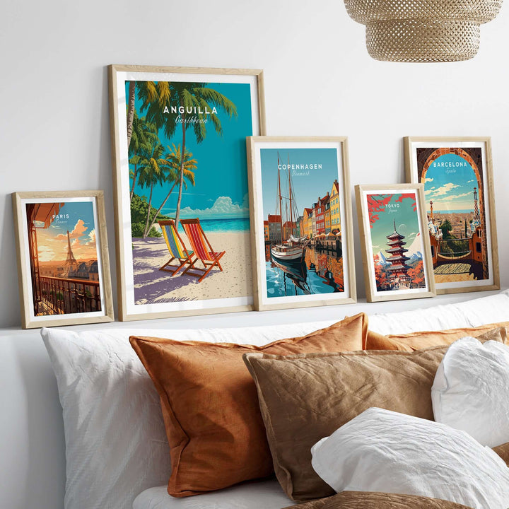 Anguilla Caribbean wall art print displayed with other travel posters on a stylish sofa, creating a vibrant home decor aesthetic.