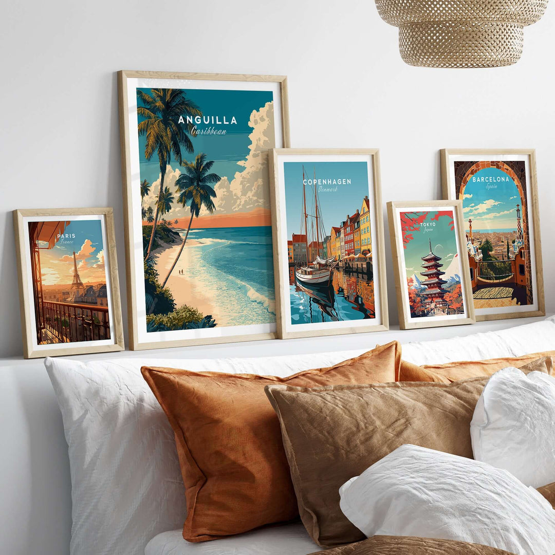 Framed Anguilla poster and travel art prints depicting Caribbean beach and city landscapes in a stylish home setting.