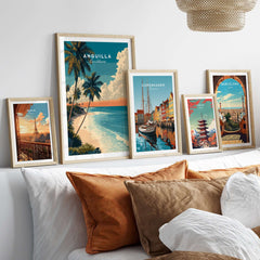 Anguilla Poster Caribbean Beach Wall Art displayed among framed travel posters on a cozy sofa.