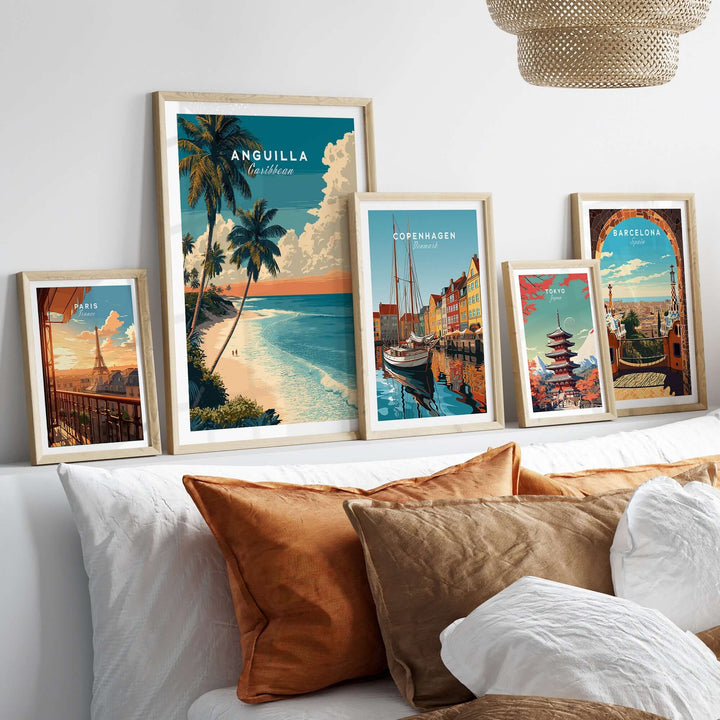 Framed Anguilla poster and travel art prints depicting Caribbean beach and city landscapes in a stylish home setting.