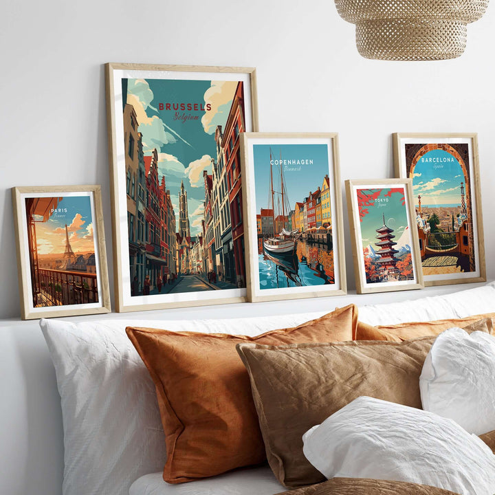 Brussels Belgium Grand Place artwork framed on a bed with decorative pillows showcasing iconic cityscapes.