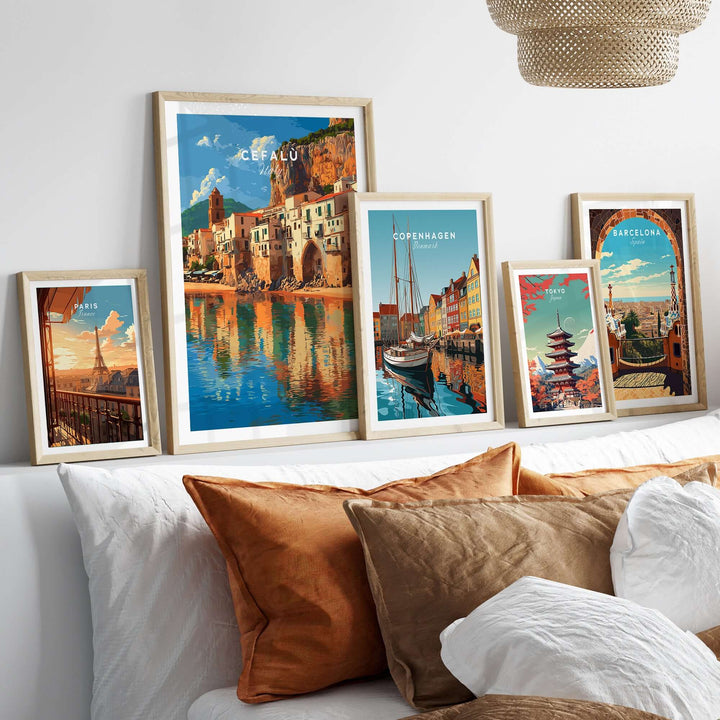 Cefalù Italy travel print along with framed wall art of various cities, adding charm to a cozy living room.