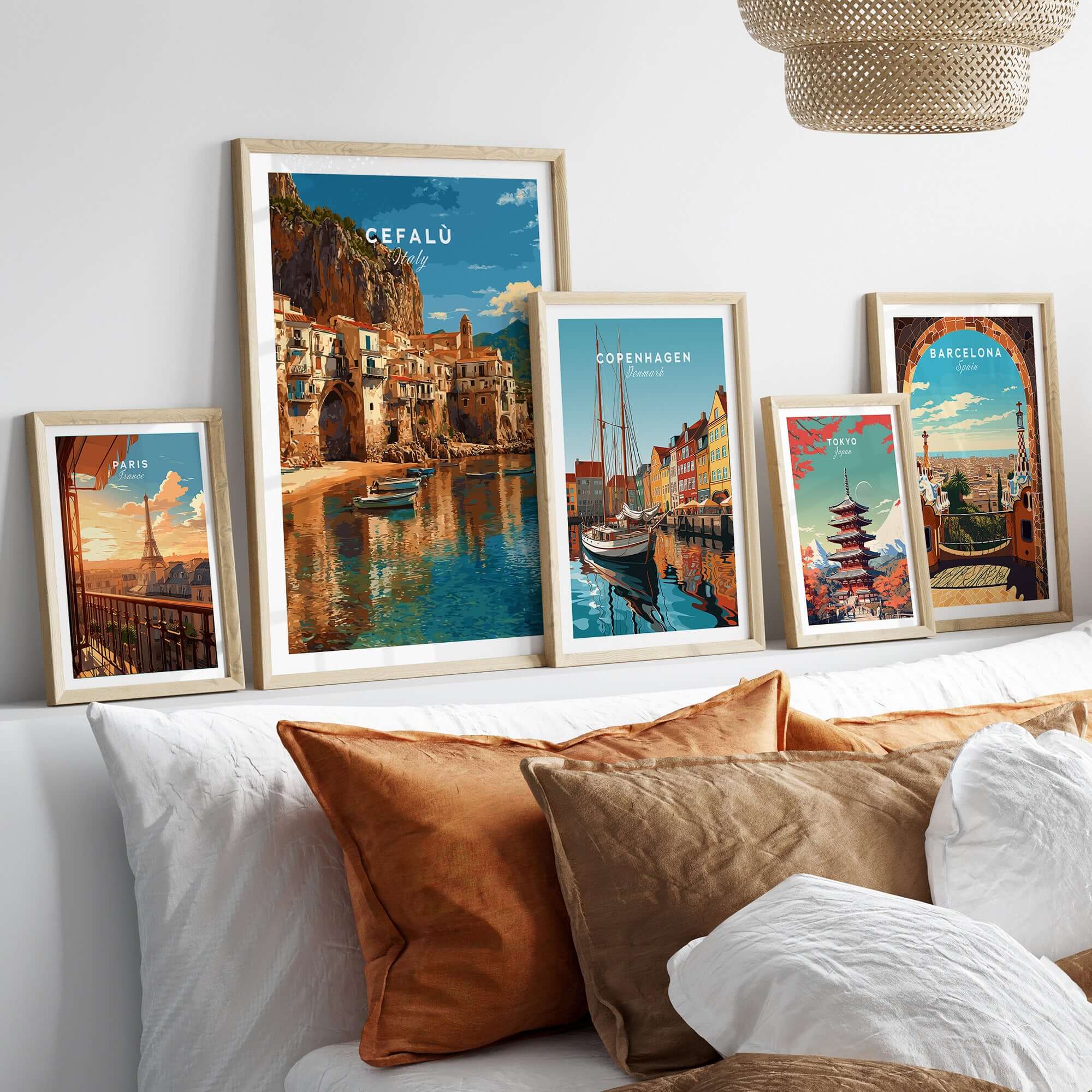 Cefalù Italy Poster - Sicilian Coastline Art Print showcased among framed art prints on a modern couch.