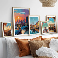 Cincinnati Ohio Sunset Skyline Poster - Roebling Bridge Wall Art displayed among various city posters on a stylish wall.