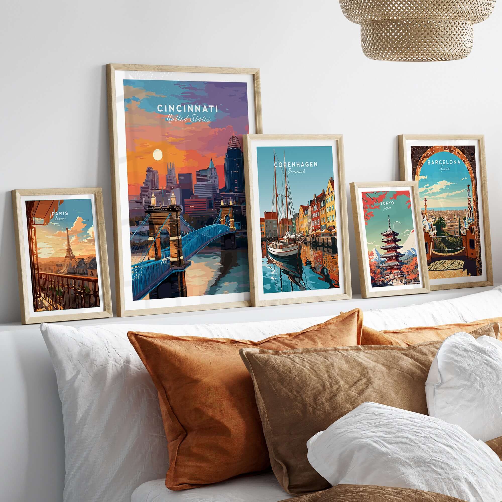 Cincinnati Ohio Sunset Skyline Poster - Roebling Bridge Wall Art displayed among various city posters on a stylish wall.