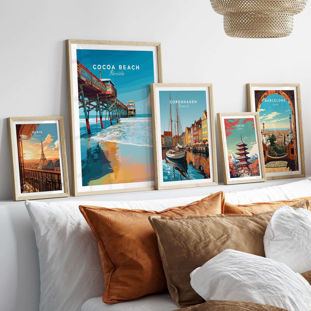 Colorful Cocoa Beach Florida Pier print among framed travel art on a stylish bohemian interior wall.