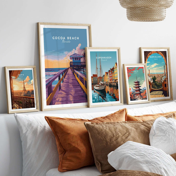 Cocoa Beach Boardwalk print among other travel-themed artwork in a stylish interior setting.