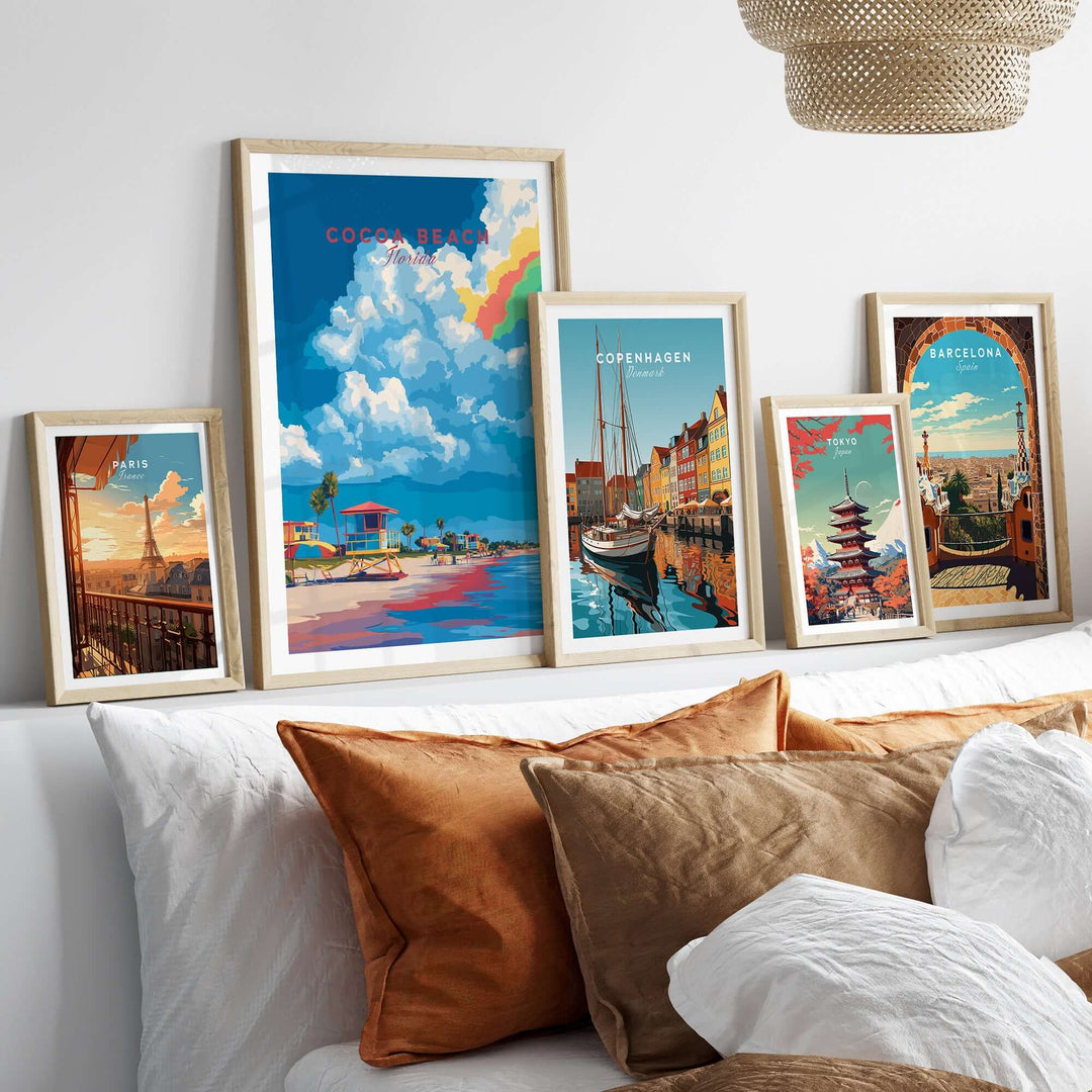 Framed Cocoa Beach Lifeguard Stand print and other city art on a stylish bedroom wall with decorative pillows.