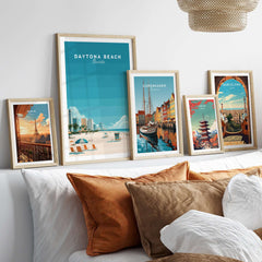 Daytona Beach Florida Lifeguard Station Print - Sunny Beach Wall Art framed above a bed with decorative pillows.