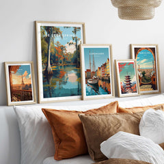 De Leon Springs Poster - Serene Florida State Park Wall Art displayed among other travel posters on a cozy couch.