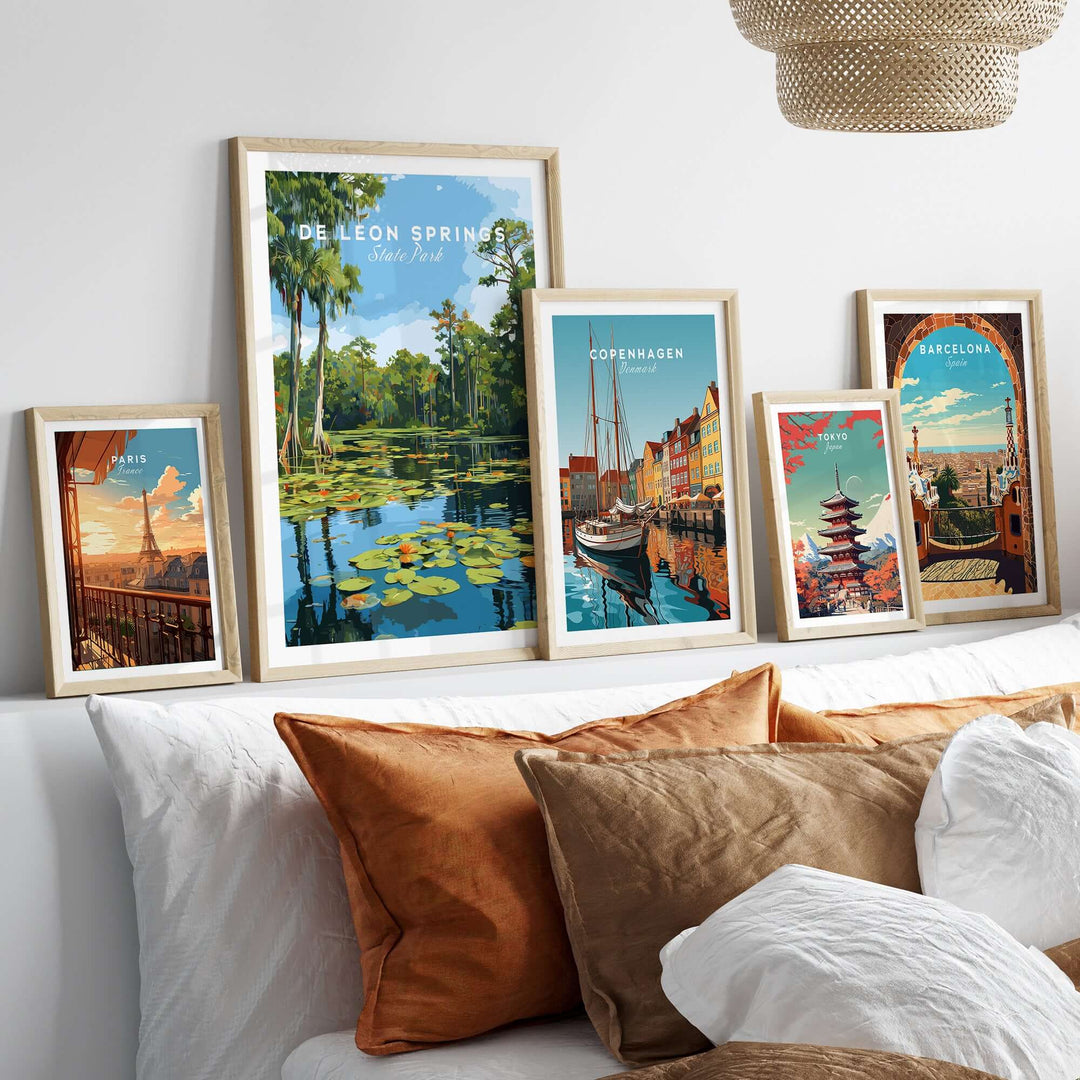 De Leon Springs Lily Pads wall art among other travel prints on a stylish sofa.