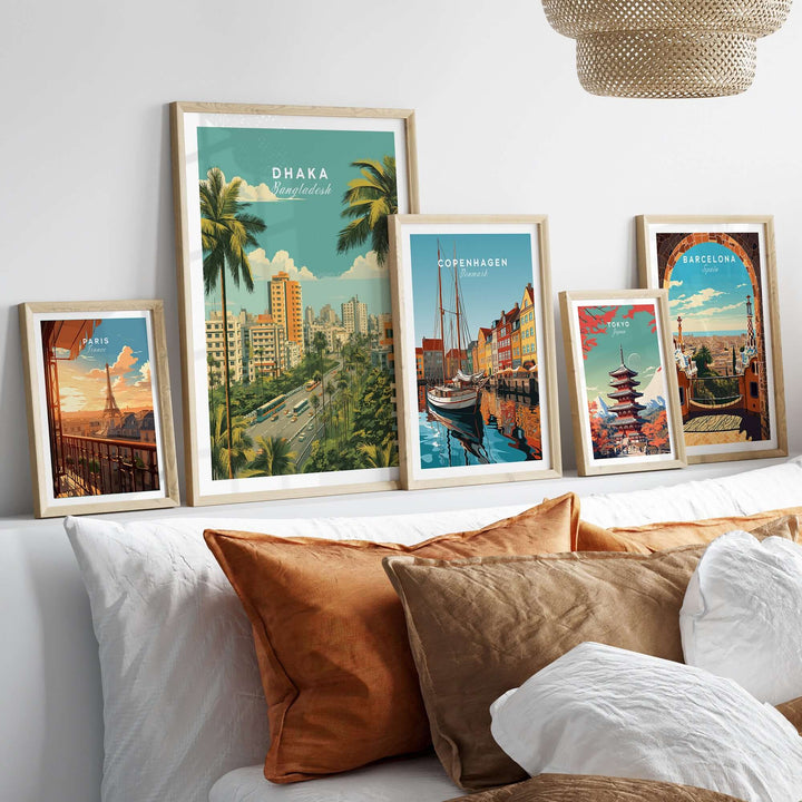 Modern city landscape posters including Dhaka, Copenhagen, and Barcelona displayed above a cozy sofa.