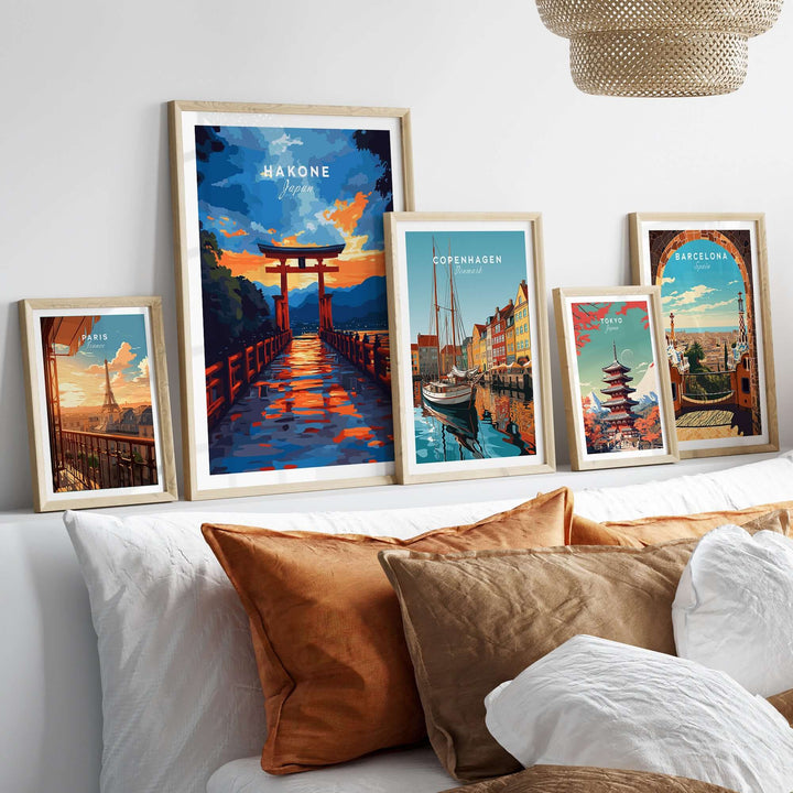 Vibrant Hakone wall art featuring a Torii gate, framed prints of various cities on a stylish bed display.