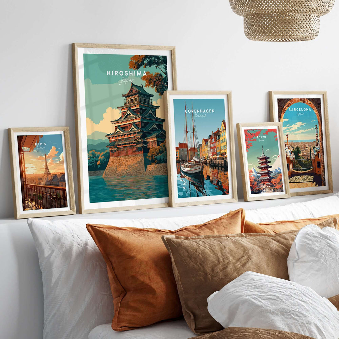 Hiroshima print featuring historic Japanese architecture among various framed city posters on a stylish sofa.