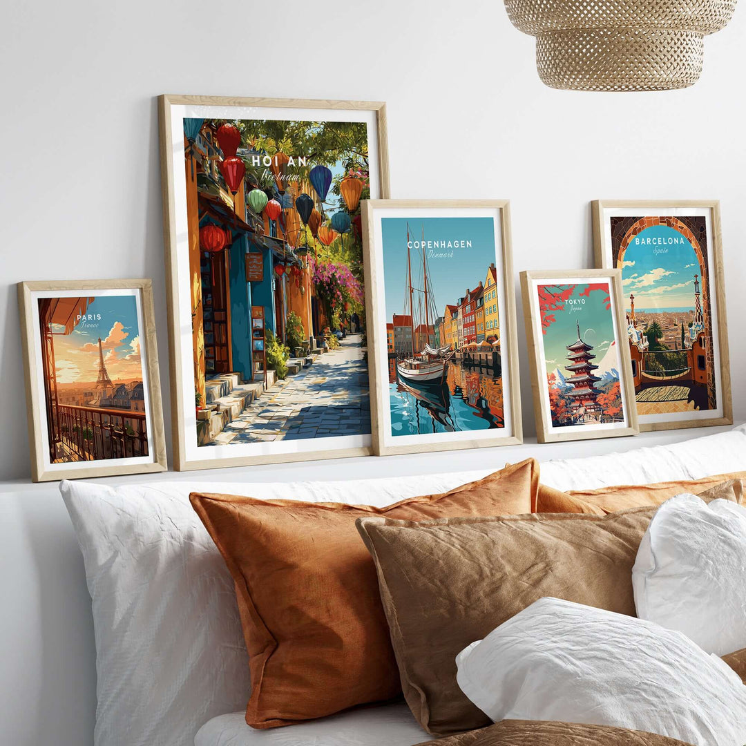 Gallery wall featuring vibrant prints of Hoi An, Copenhagen, and Barcelona with cozy decor.