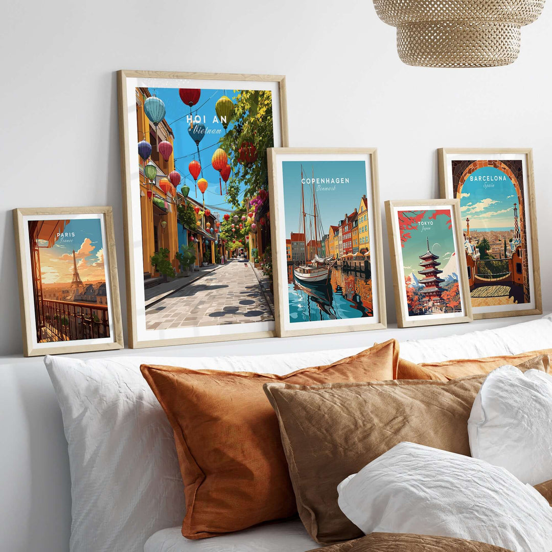Vibrant Hoi An Vietnam colorful lantern street poster alongside framed city prints on a stylish couch.