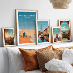 Huntington Beach Lifeguard Tower Print - California Sunset Wall Art displayed on a cozy couch with other travel artworks.