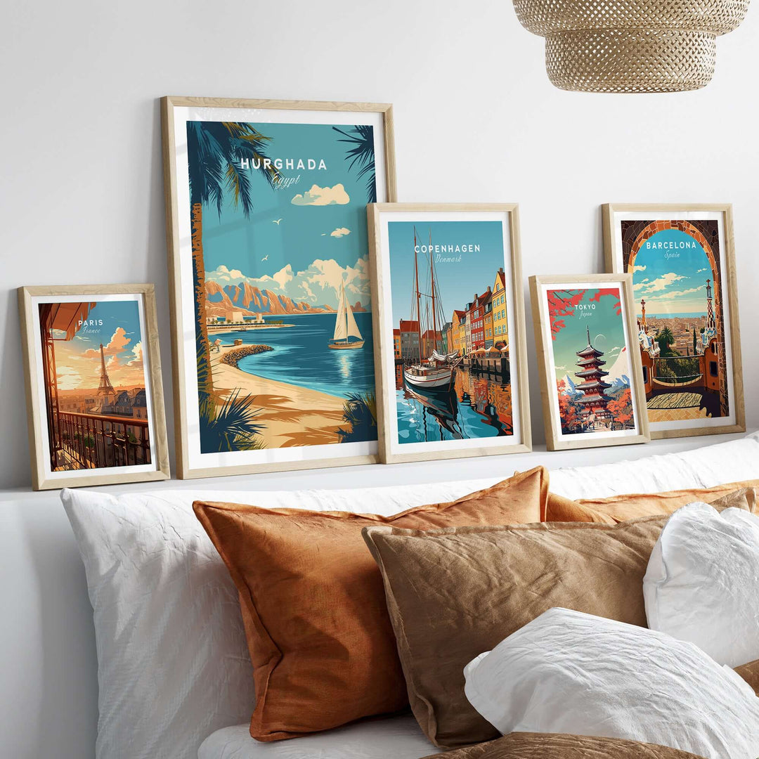 Gallery of framed travel prints featuring Hurghada, Copenhagen, and Barcelona on a stylish sofa backdrop.