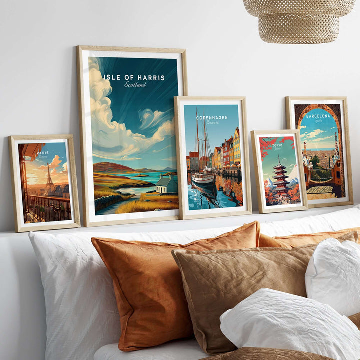 Isle of Harris print and other city prints displayed in frames on a couch, showcasing rustic wall art decor.