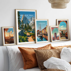 John Muir Trail California Lakeside Mountain Trail Poster - Wilderness Landscape Print framed with travel posters on a sofa.