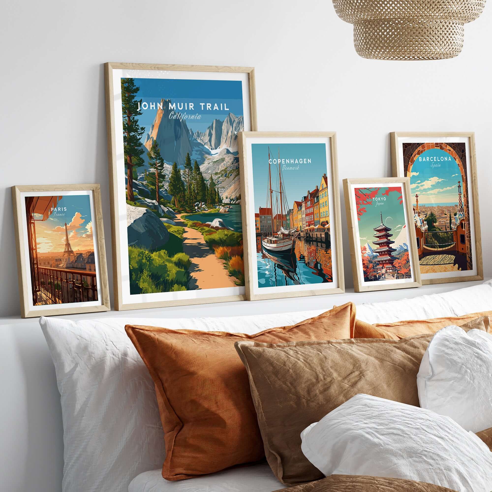 John Muir Trail California Lakeside Mountain Trail Poster - Wilderness Landscape Print framed with travel posters on a sofa.