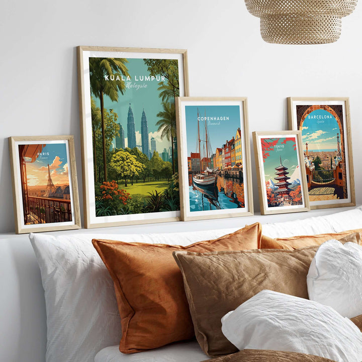 Kuala Lumpur Twin Towers wall art among other city prints on a stylish couch with cushions.
