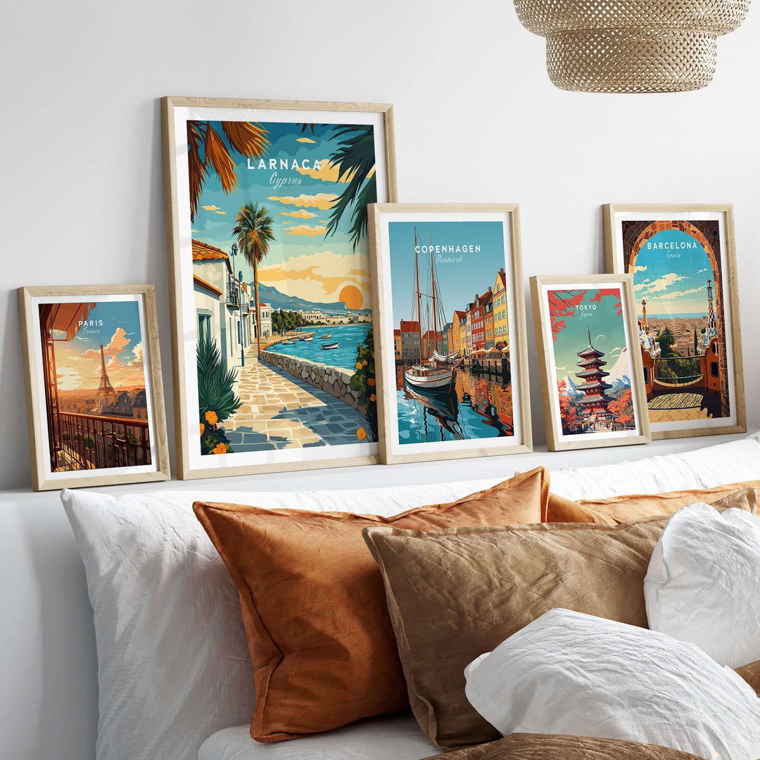 Larnaca Cyprus sunset print alongside Danish and Spanish cityscape posters in a cozy home setting.