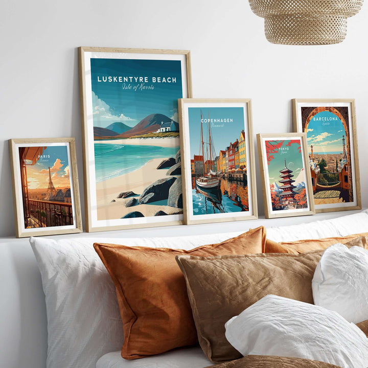 Luskentyre Beach print surrounded by coastal and city posters on a stylish wall decor above a cozy sofa.