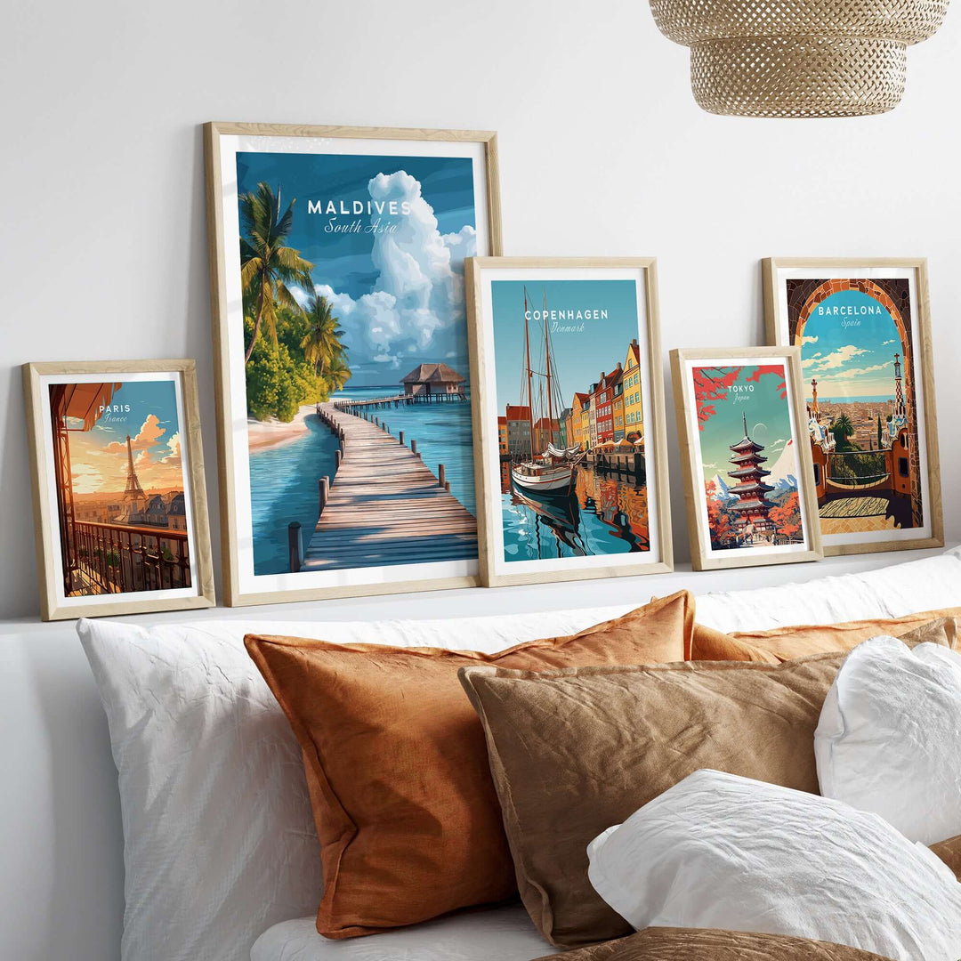 Maldives Travel Print - Beach Scene with framed artwork of tropical destinations on a cozy sofa.