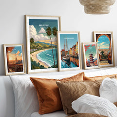 Malibu California Print - Beach Wall Art displayed among other city prints in a cozy living room setting.