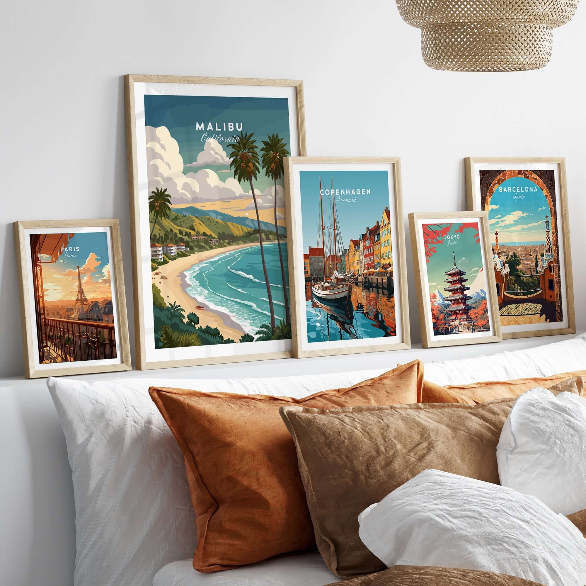 Malibu California Print - Beach Wall Art displayed among other city prints in a cozy living room setting.