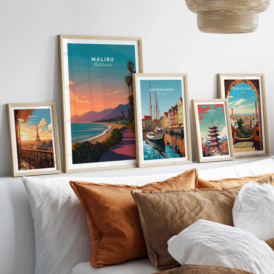 Framed art prints of Malibu, Copenhagen, and Barcelona showcasing vibrant coastal and city landscapes.