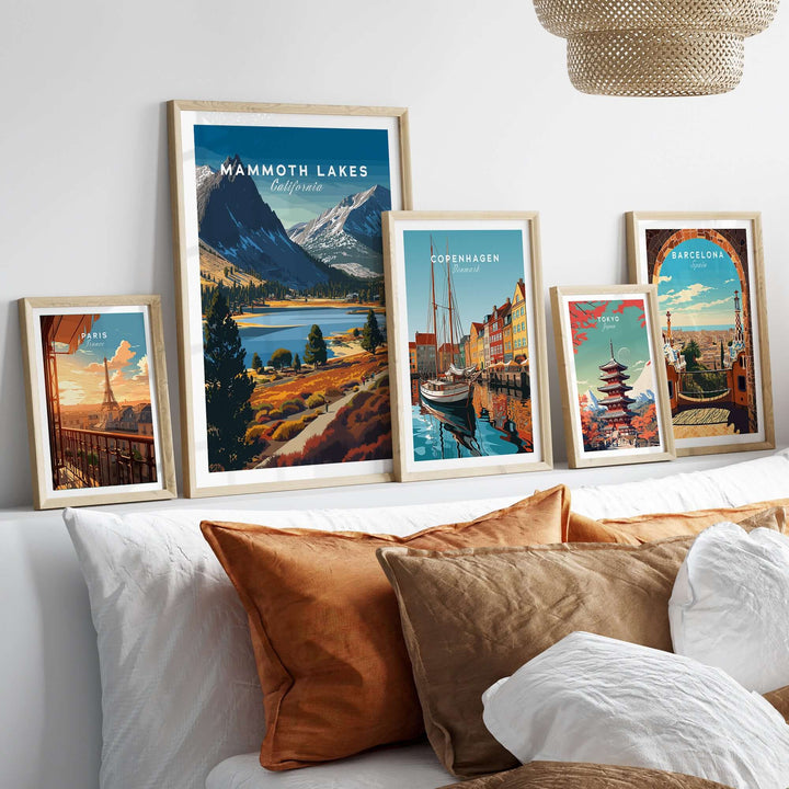 Framed Mammoth Lakes California print and other travel posters on a stylish sofa display.
