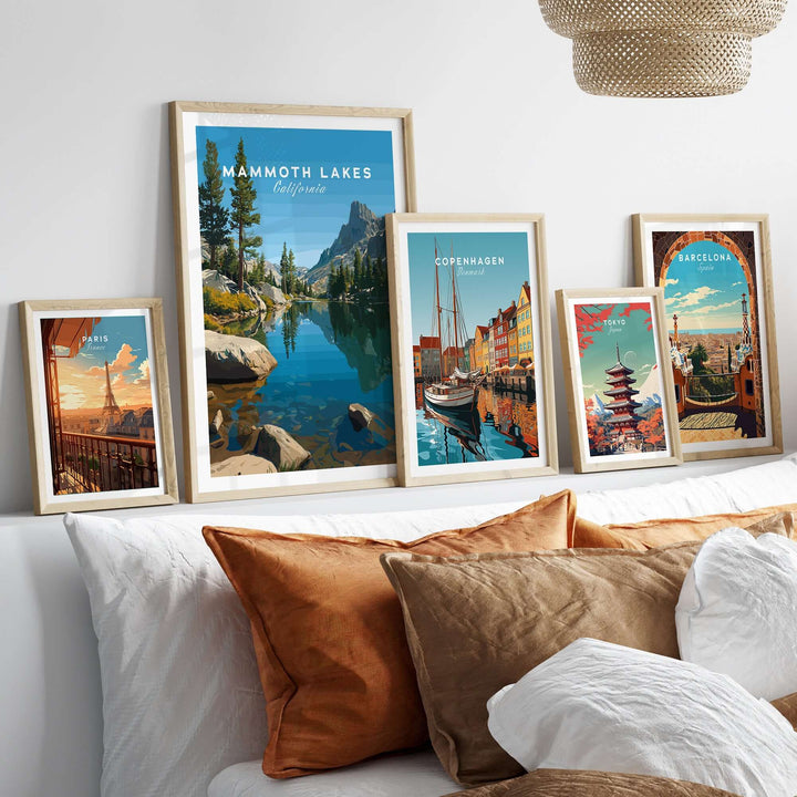Collection of travel posters including Mammoth Lakes, showcasing stunning landscapes and vibrant colors in a cozy room setting.