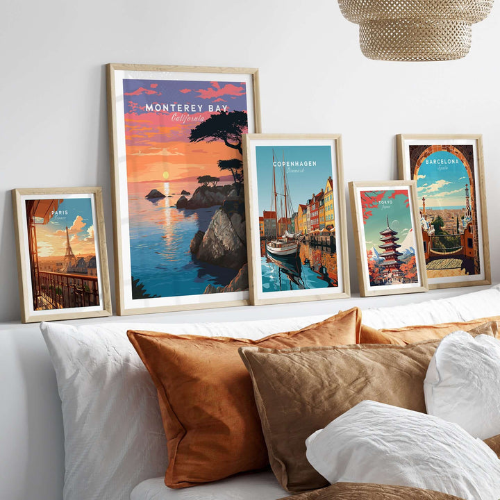 Monterey Bay print and framed wall art featuring coastal views, displayed on a stylish bed with cushions.