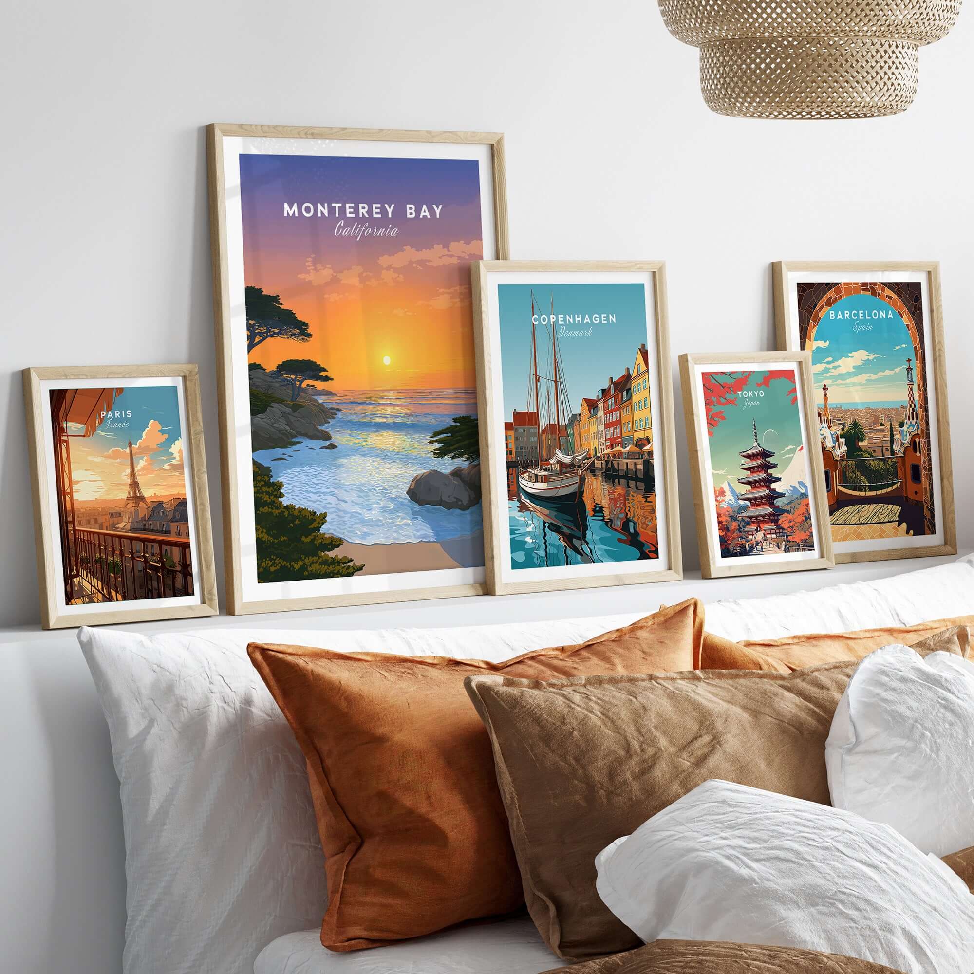Monterey Bay California Print - Stunning Sunset Wall Art displayed in frames on a stylish bed with cozy pillows.